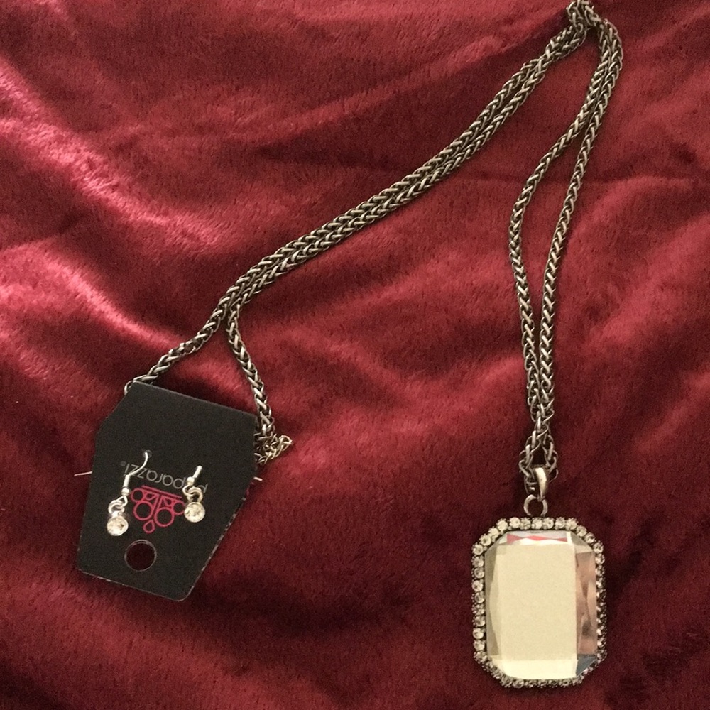 I’m selling a 16’ silver necklace with earring